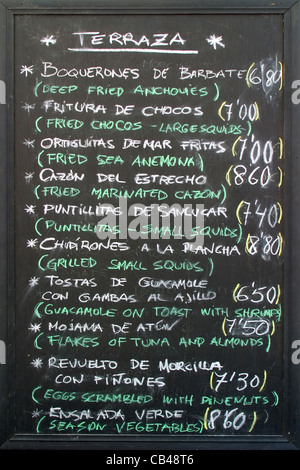 Spanish restaurant menu written on blackboard in Vejer, Andalucia, Spain Stock Photo