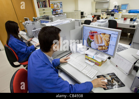 China, Hong Kong, Male Office Worker on Computer Stock Photo