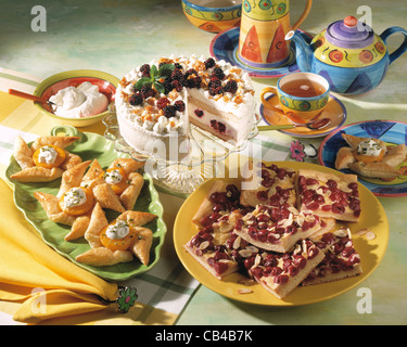 Tableau: blackberry brittle tarte / cherry slices with kefir cream / peach tartlets Stock Photo