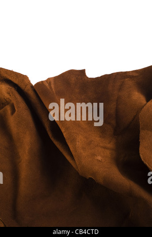 Brown cow leather texture close up on white background. Included clipping path, so you can easily cut it out and place over the top of a design. Stock Photo