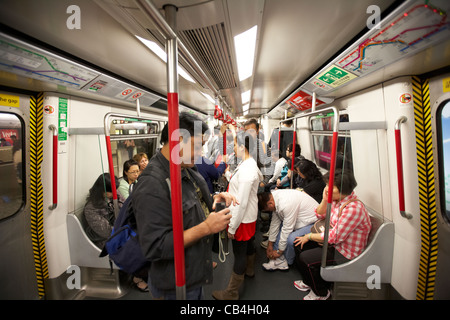 passengers on board mtr underground train at station kowloon hong kong china Stock Photo