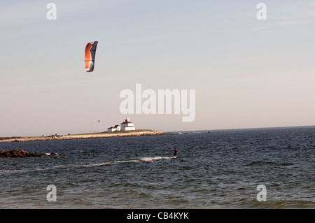 Kiteboarder at watch hill with lighthouse in background Stock Photo