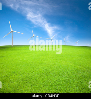 Wind turbines in an green field with cloud background Stock Photo
