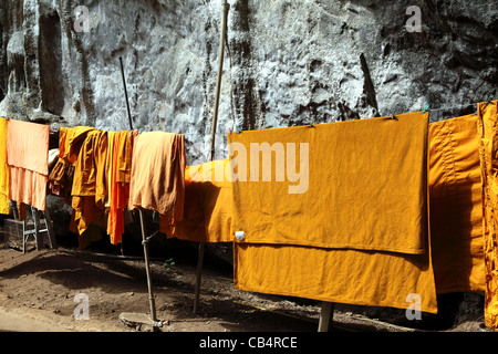 Monks robes drying on washing line at Wat Tham Seua (Tiger Cave) temple, Krabi, Thailand, Southeast Asia, Asia Stock Photo
