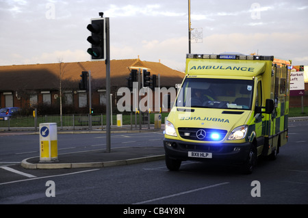 Ambulance on emergency call heading for hospital Stock Photo