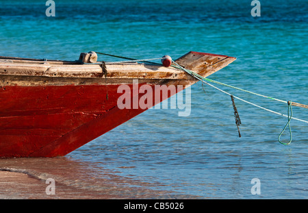 Fishing boat moored on a sandy shore Stock Photo