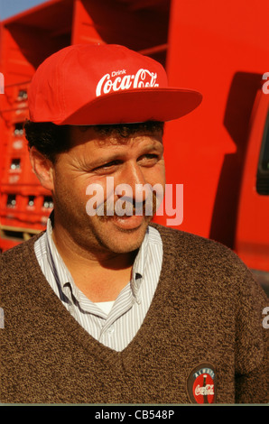 Truck driver with Coca-Cola truck delivering soft drinks, Jordan Stock Photo