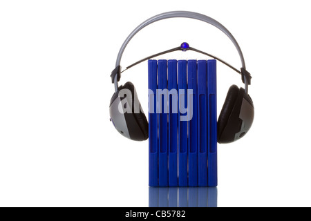 headphones holding blue cases isolated in white with reflection Stock Photo