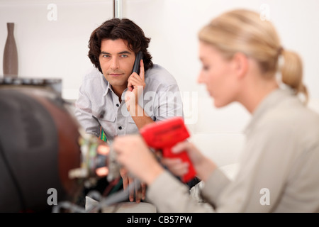 Technician fixing a television Stock Photo