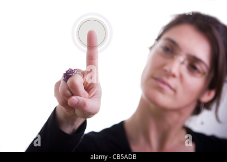 a businesswoman pressing a hi-tech button (you can write your command on the button: login, enter start, yes, no, ...) Stock Photo