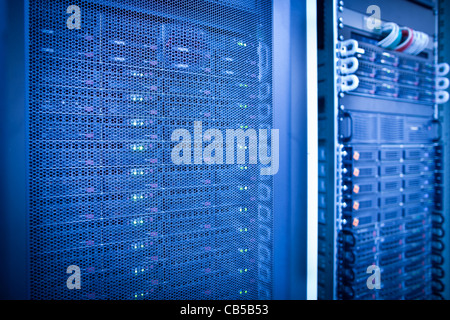 Server rack cluster in a data center (shallow DOF; color toned image) Stock Photo