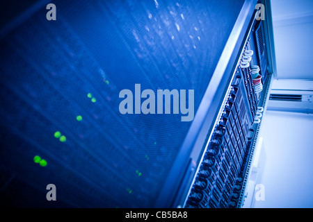 Server rack cluster in a data center (shallow DOF; color toned image) Stock Photo