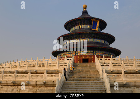 Couple at Hall of Prayer for Good Harvests at Temple of Heaven Park Beijing at sunset Peoples Republic of China Stock Photo