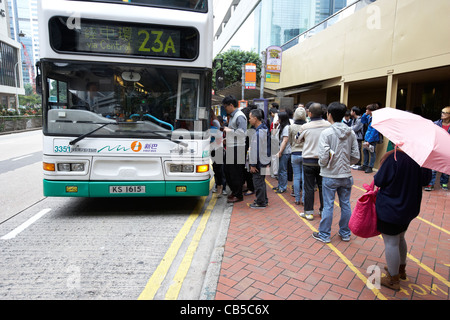 chinese people boarding a bus in downtown admiralty district hong kong island hksar china Stock Photo