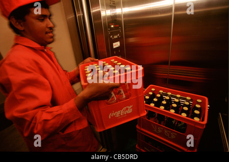 Truck driver with Coca-Cola truck delivering soft drinks, Jordan Stock Photo