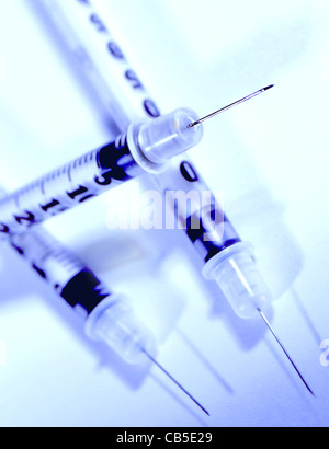 Three syringes on a white background. Still life. Stock Photo