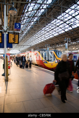 Virgin Pendolino Train and Passengers at Manchester Piccadilly Railway Station, UK