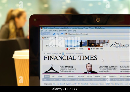 The Financial Times website shot in a coffee shop environment (Editorial use only: print, TV, e-book and editorial website). Stock Photo