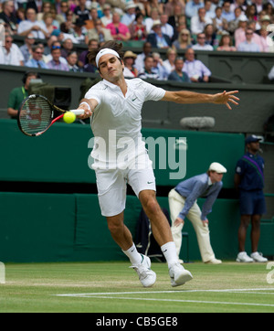 29.06.2011. Jo-Wilfried Tsonga FRA (12) v Roger Federer SUI (3). Federer in action. The Wimbledon Tennis Championships. Stock Photo