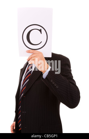 businessman hiding behind the copyright symbol Stock Photo