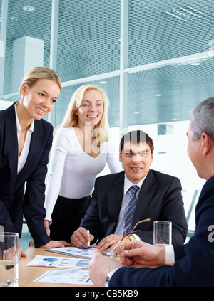 Business team listening to their business leader Stock Photo