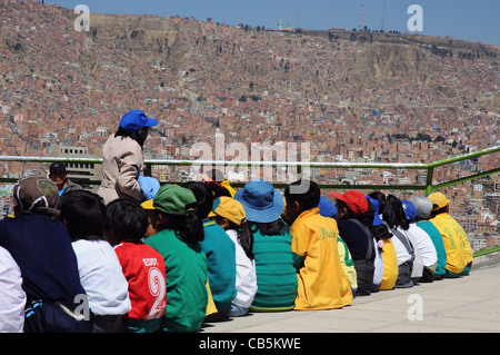 Bolivian schoolchildren having an outdoor lesson on Killi Killi Mirador in La Paz, Bolivia Stock Photo