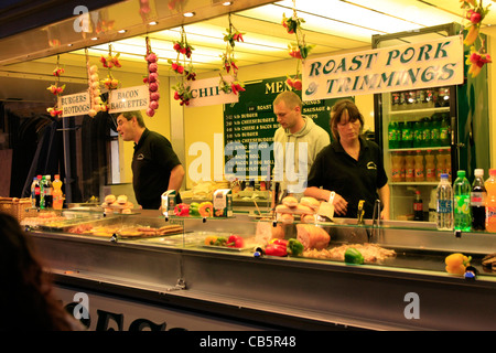 Roast Pork on sale from an evening Street Market Stall in Sherborne Dorset Stock Photo