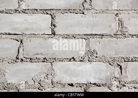 wall of gray brick and cement a close-up Stock Photo