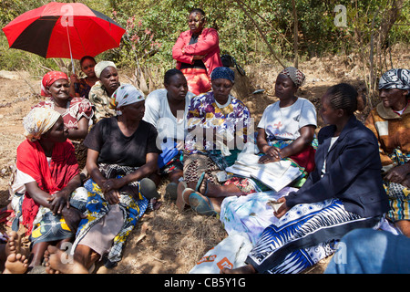 A finance self help group, Nairobi, Kenya. They meet regularly talk about saving money and to give out loans to each other. Stock Photo