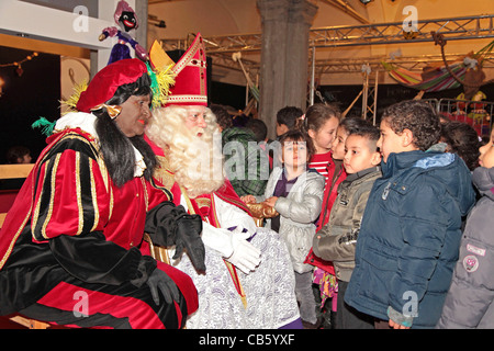 Sinterklaas and Zwarte Piet with dutch children Stock Photo