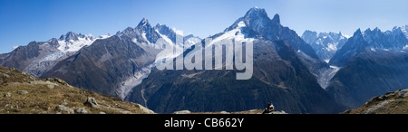 Views across the Chamonix Valley towards three glaciers and the Aiguilles mountains, grand balcon sud cairn in foreground. Stock Photo