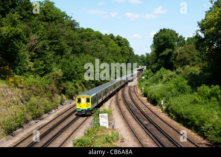 Commuter train outside Ravensbourne station on the line between London and Sevenoaks in Kent, approaching Shortlands. Stock Photo