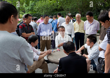 Chinese men playing cards in People's Park, Shanghai, PRC, People's Republic of China, Asia Stock Photo