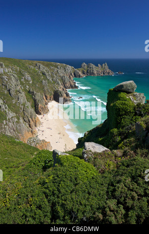 Surf and turquoise sea at Pednvounder beach in summer sunshine, Treen Cliff, near Porthcurno,  Lands End Peninsula, Cornwall Stock Photo