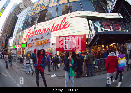 Employees drum up business outside the Aeropostale store in Times Square in New York on Thanksgiving Day Stock Photo
