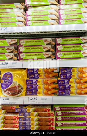Shelves of frozen gluten, dairy and nut free food in the freezer department in a Tesco store Stock Photo