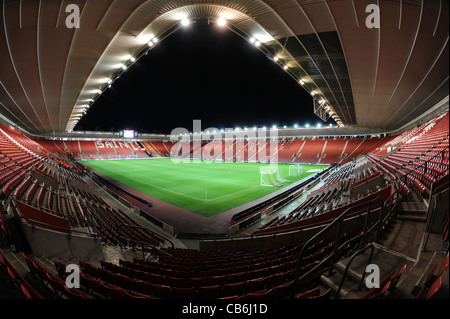 View inside St. Mary's Stadium at night under floodlights, home of Southampton Football Club Stock Photo