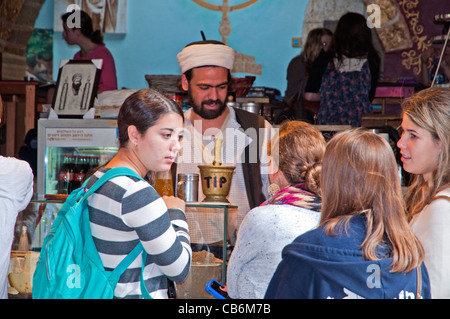 Young tourist coming for coffe in  Tzfat exotic street cafe, Safed, Galilee, Israel,Asia, Middle East Stock Photo