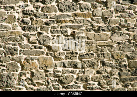 Gray primitive masonry rock stone wall background Stock Photo