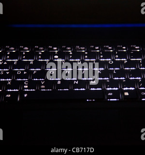 Lit Keyboard on Laptop Stock Photo