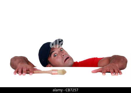 craftsman painter slipping and falling down Stock Photo