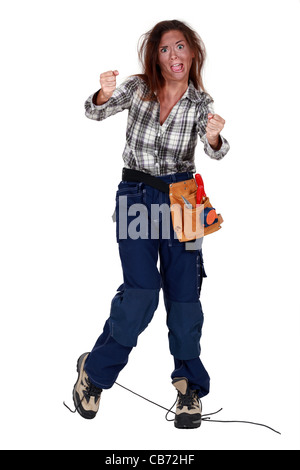 Woman receiving electrical shock Stock Photo