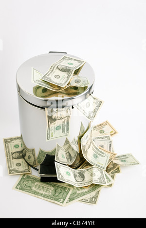 finance concept with money and metal tub on light grey background, focus on nearest part Stock Photo