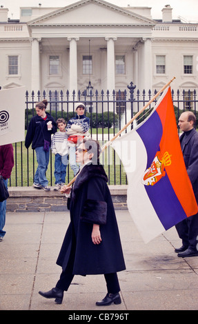 Serbian protesters rally outside the White House March 28, 1999 as hundreds gathered to demand an end to NATO air attacks on Yugoslavia. Protests took place in major cities around the world including shots being fired at the US Embassy in Moscow. Stock Photo