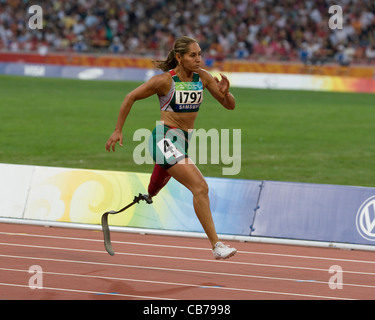 athletic competition 2008 Paralympic Games Mexican  female amputee with prosthetic leg running 100 meter race Stock Photo