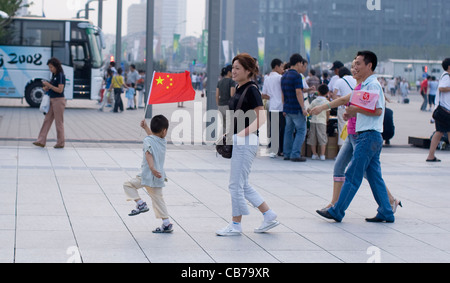 Beijing, China September 13, 2008: Paralympic Games shows Chinese family walking near the Water Cube National Swim Center Stock Photo