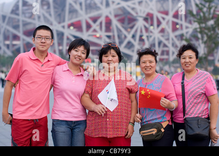 Beijing, China September 13, 2008: Paralympic Games shows Chinese family posing outside National Stadium Birds Nest Stock Photo