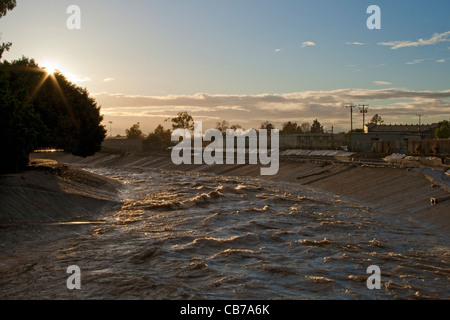 Rain water empties from Storm Pipes into Ballona Creek, a nine-mile waterway that drains the Los Angeles basin. Culver City, CA Stock Photo