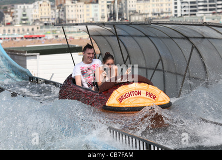 A couple having fun a water ride on Brighton Pier. Picture by James Boardman. Stock Photo