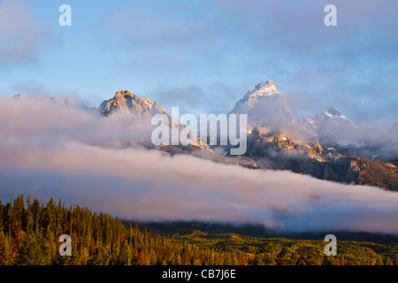 Sunrise with low-lying clouds, fog and mist at the Grand Tetons National Park in Wyoming. Stock Photo